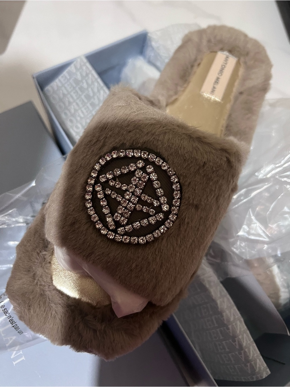 ANTONIO MELANI Taupe Faux-Fur Slide with Crystal Emblem